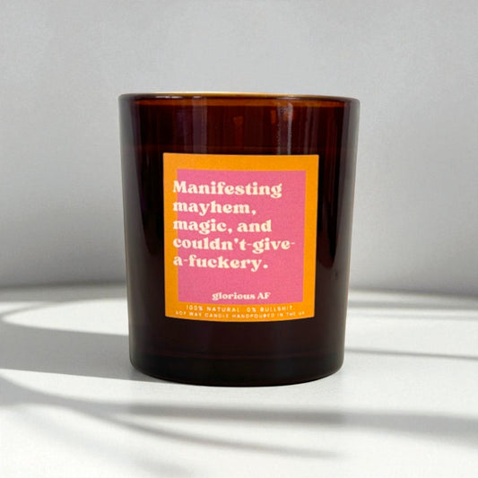 "Manifesting mayhem, magic, and couldn’t-give-a-f*ckery." Funny Candle
